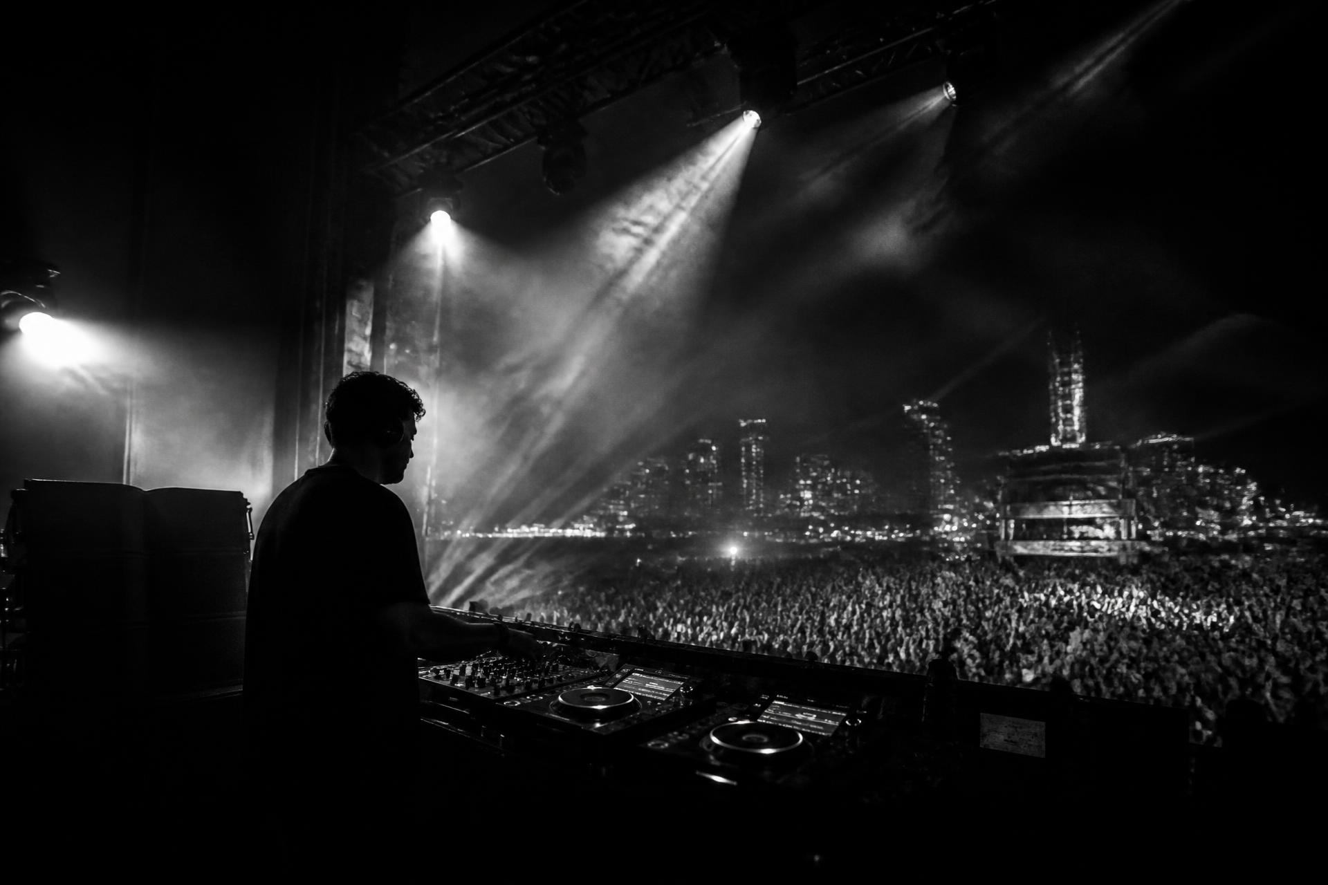 CUE Artist Agency — DJ performing on a major stage